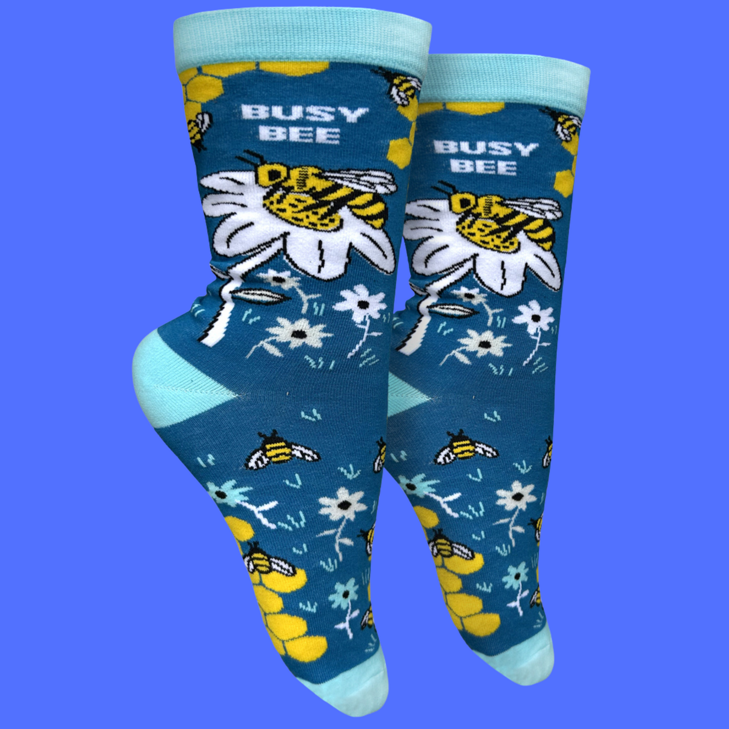 
                  
                    A pair of socks depicting busy bees. Light blue heel, toe and cuff.
                  
                