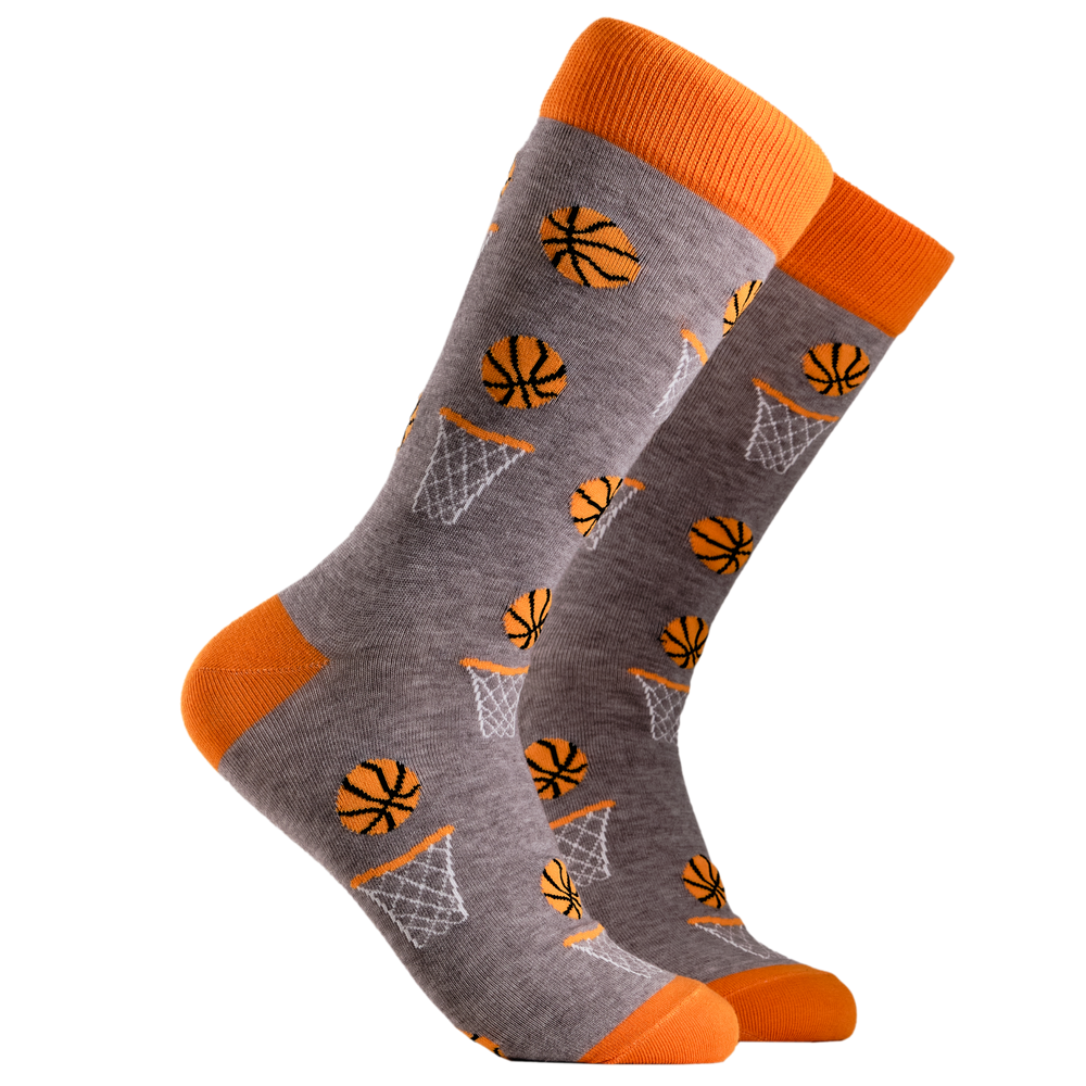 Basketball Socks. A pair of socks depicting basketballs. Grey legs, orange cuff, heel and toe.