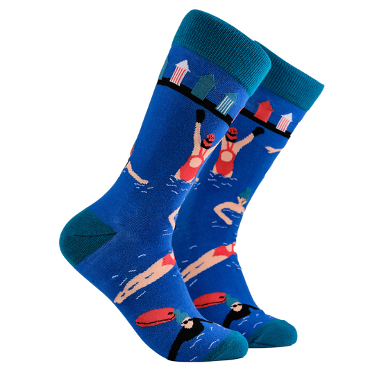 Swimming Socks - BBBRRRRRR...A pair of socks depicting swimmers and beach huts. Blue legs, light blue cuff, heel and toe.