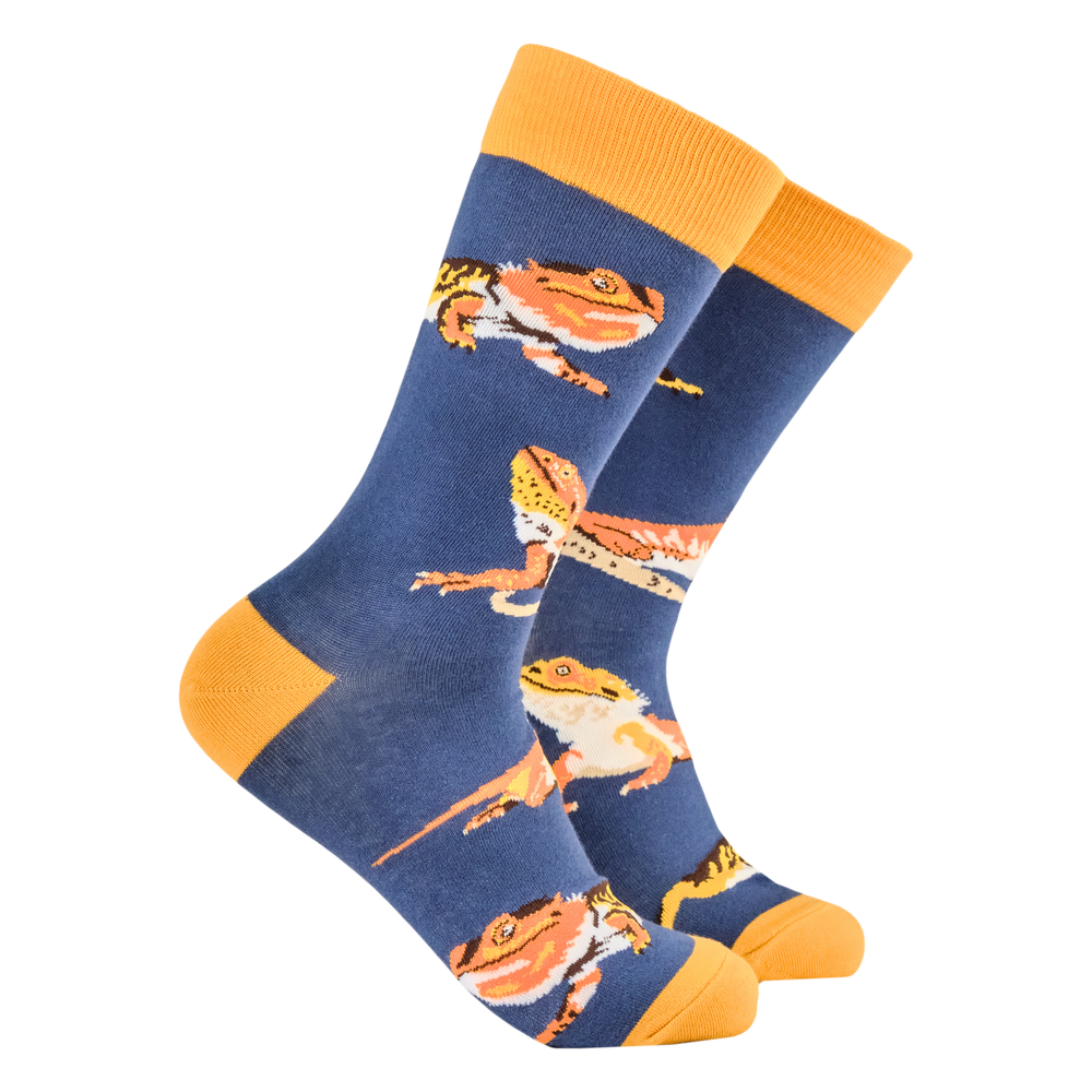 Bearded Dragon Socks. A pair of socks depicting bearded dragons. Blue legs, yellow heel, toe and cuff. 