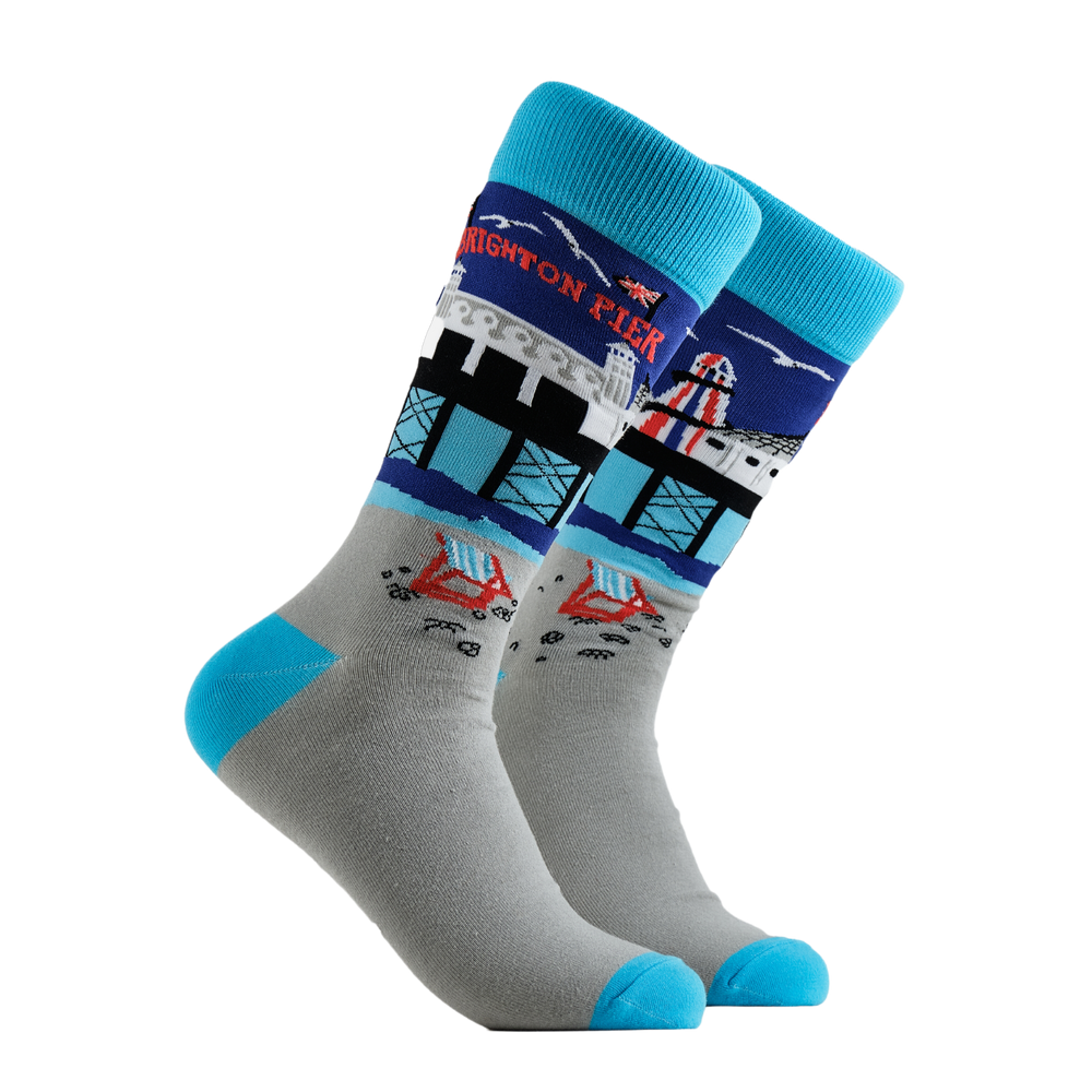 Brighton Pier Socks - Beside The Seaside. A pair of socks depicting Brighton Pier. Grey legs, light blue cuff, heel and toe.