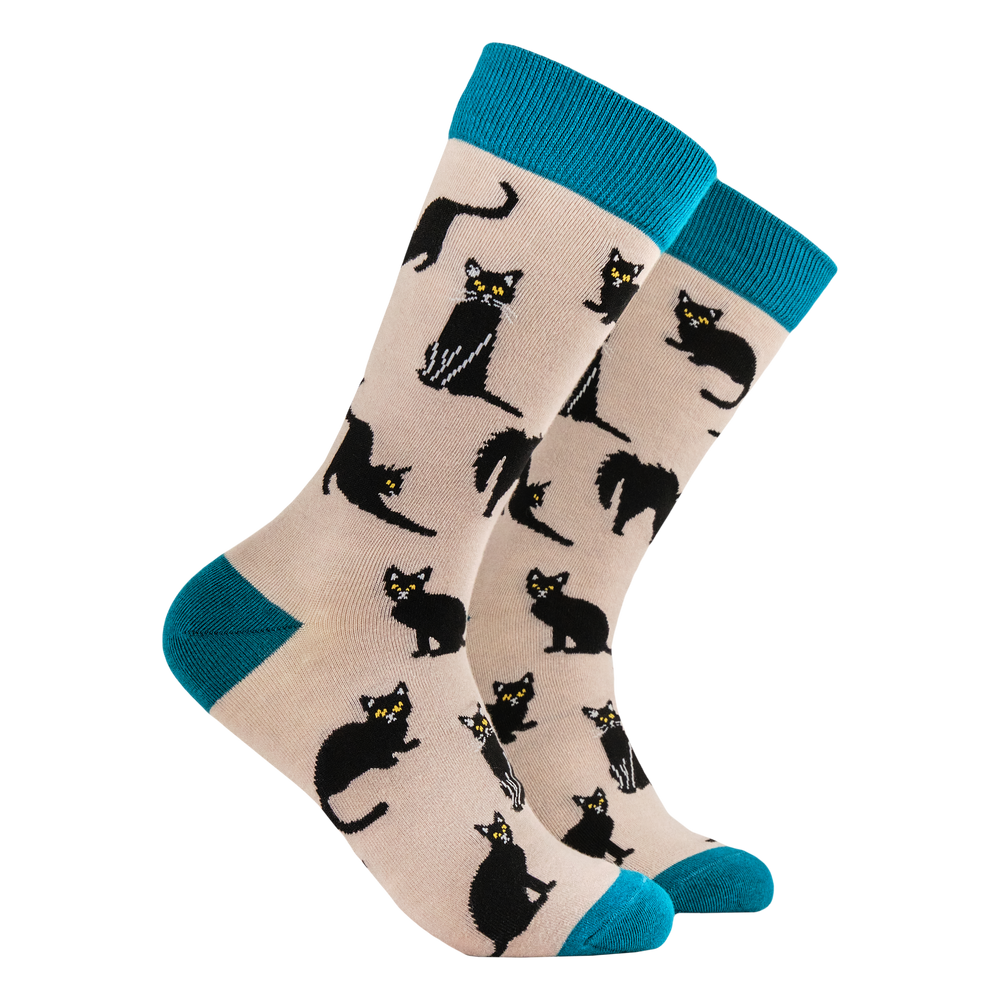 Black Cats Bamboo Socks. A pair of socks featuring lucky black cats. Beige legs, teal heel toe and cuff. 