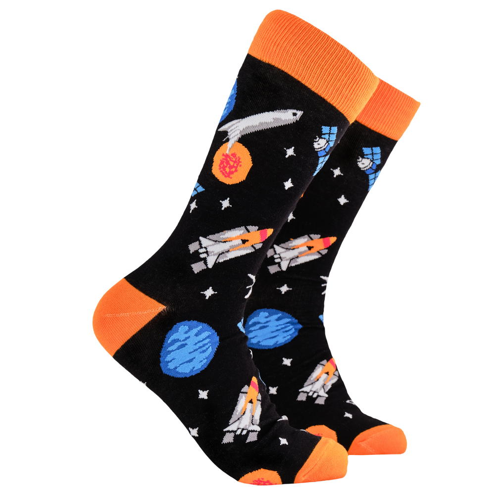 Space Socks - Blast Off. A pair of socks depicting space craft in space. Black legs, orange cuff, heel and toe.