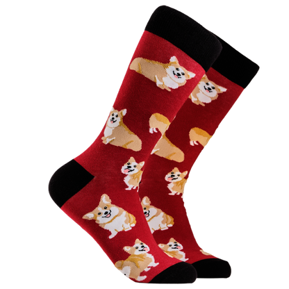 Corgis Socks. A pair of socks depicting corgis. Red legs, black cuff, heel and toe.