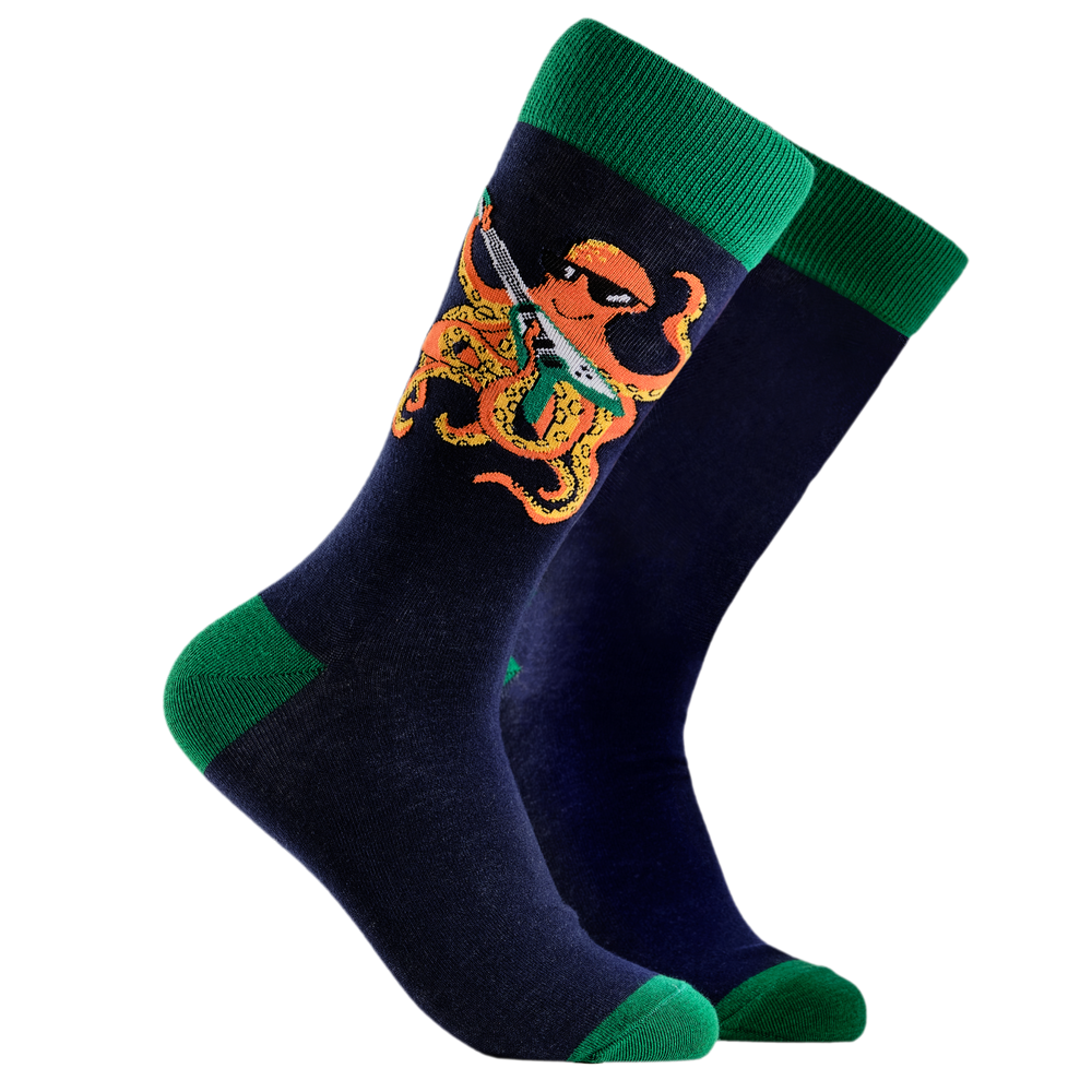 
                  
                    A pair of socks depicting an octopus playing a pink guitar. Dark blue legs, green cuff, heel and toe.
                  
                