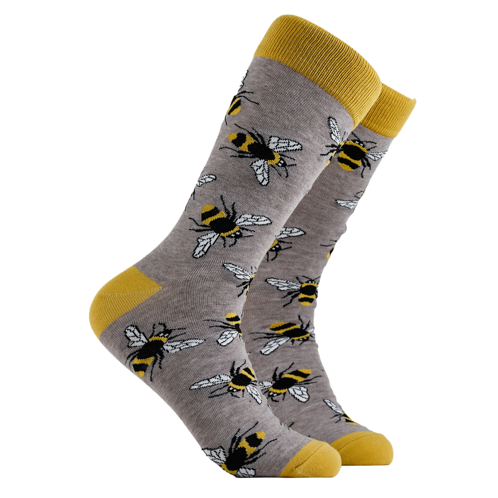 Bee Socks - Bumbling Around. A pair of socks depicting Bees. Grey legs, yellow cuff, heel and toe.
