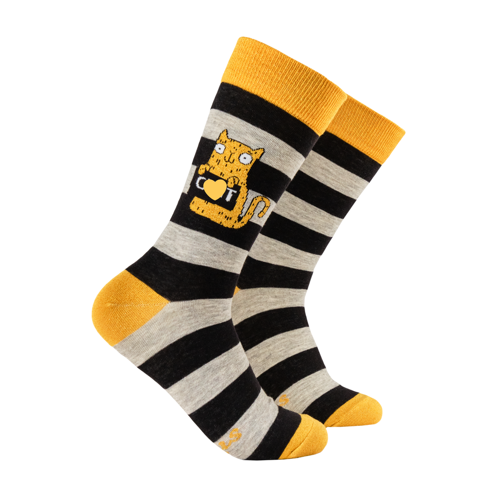 Cunt Socks - Soctopus X Katie Abey. A pair of socks featuring a cute cat holding a sweary sign. Black and grey striped legs. Yellow heel, cuff and toe. 