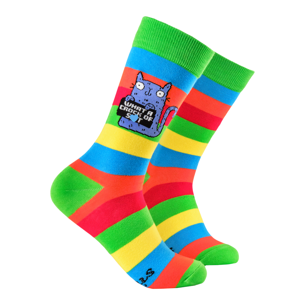 What a Crock of Shit Socks - Soctopus x Katie Abey. A pair of socks featuring a cute cat holding a sweary sign. Multicolored striped legs. 