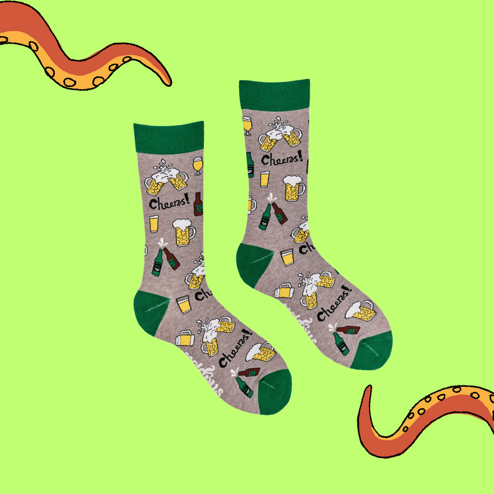 
                  
                    A pair of socks depicting pints and bottles of beer. Grey legs, green cuff, heel and toe.
                  
                