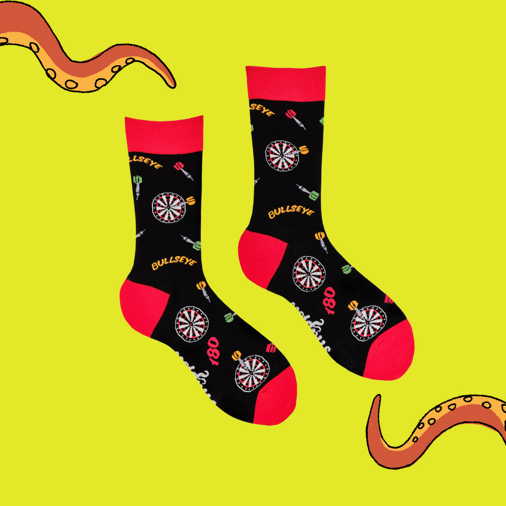 
                      
                        A pair of socks depicting darts and dartboards. Black legs, red cuff, heel and toe.
                      
                    