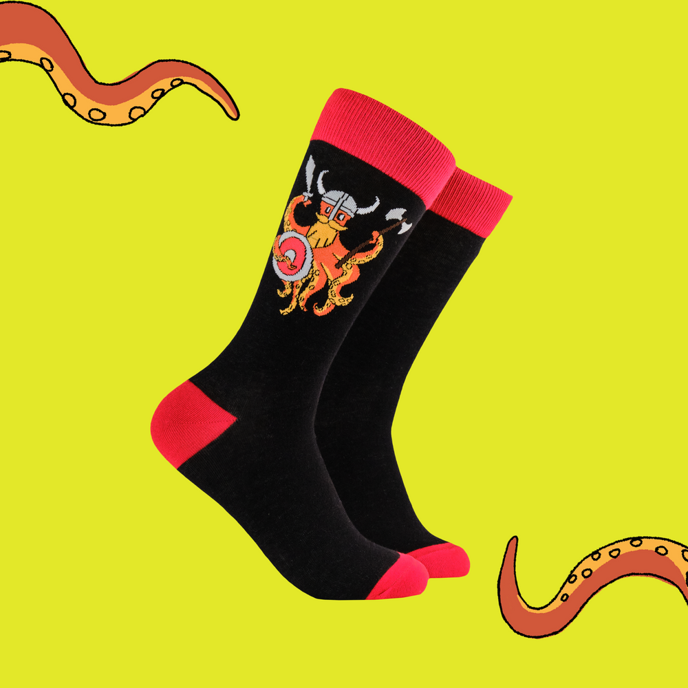 A pair of socks depicting the Soctopus mascot dressed as a viking. Black legs. Red toes, heels, cuffs. 