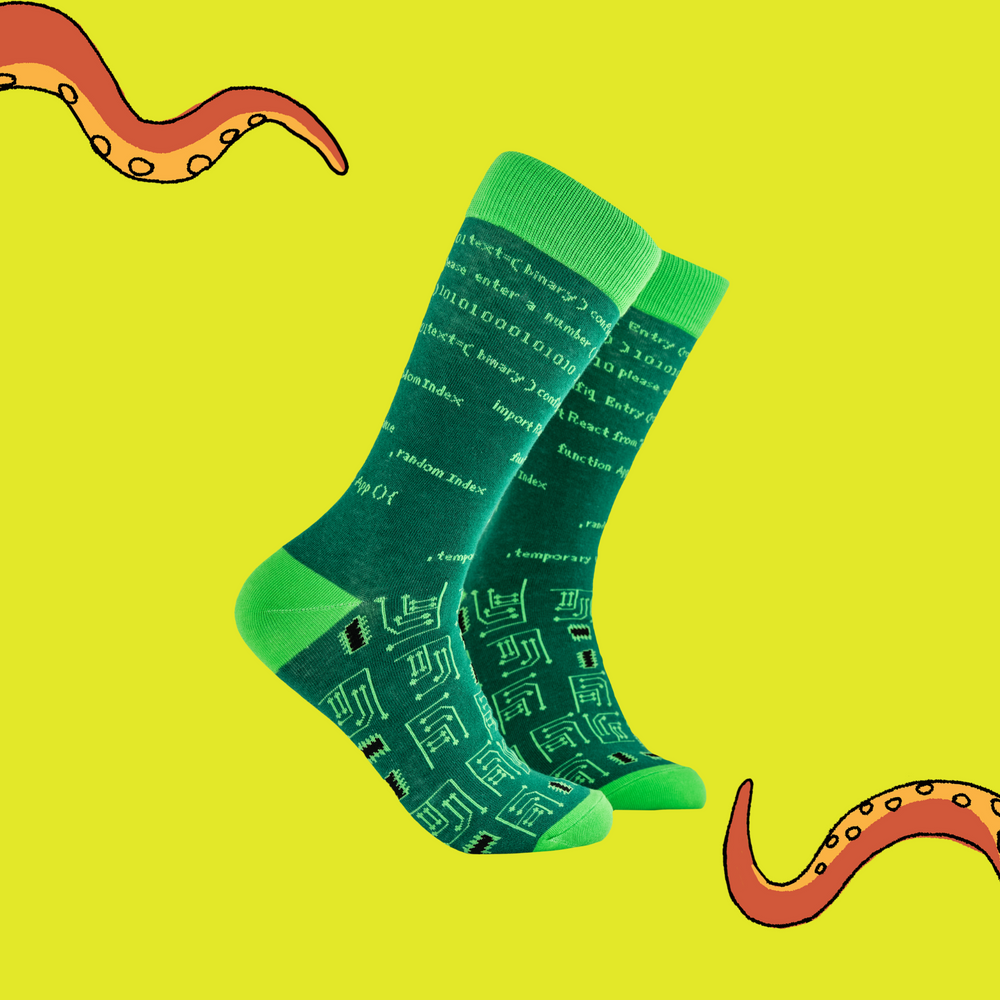 A pair of socks depicting HTML code and circuit boards. Green legs, light green cuff, heel and toe.