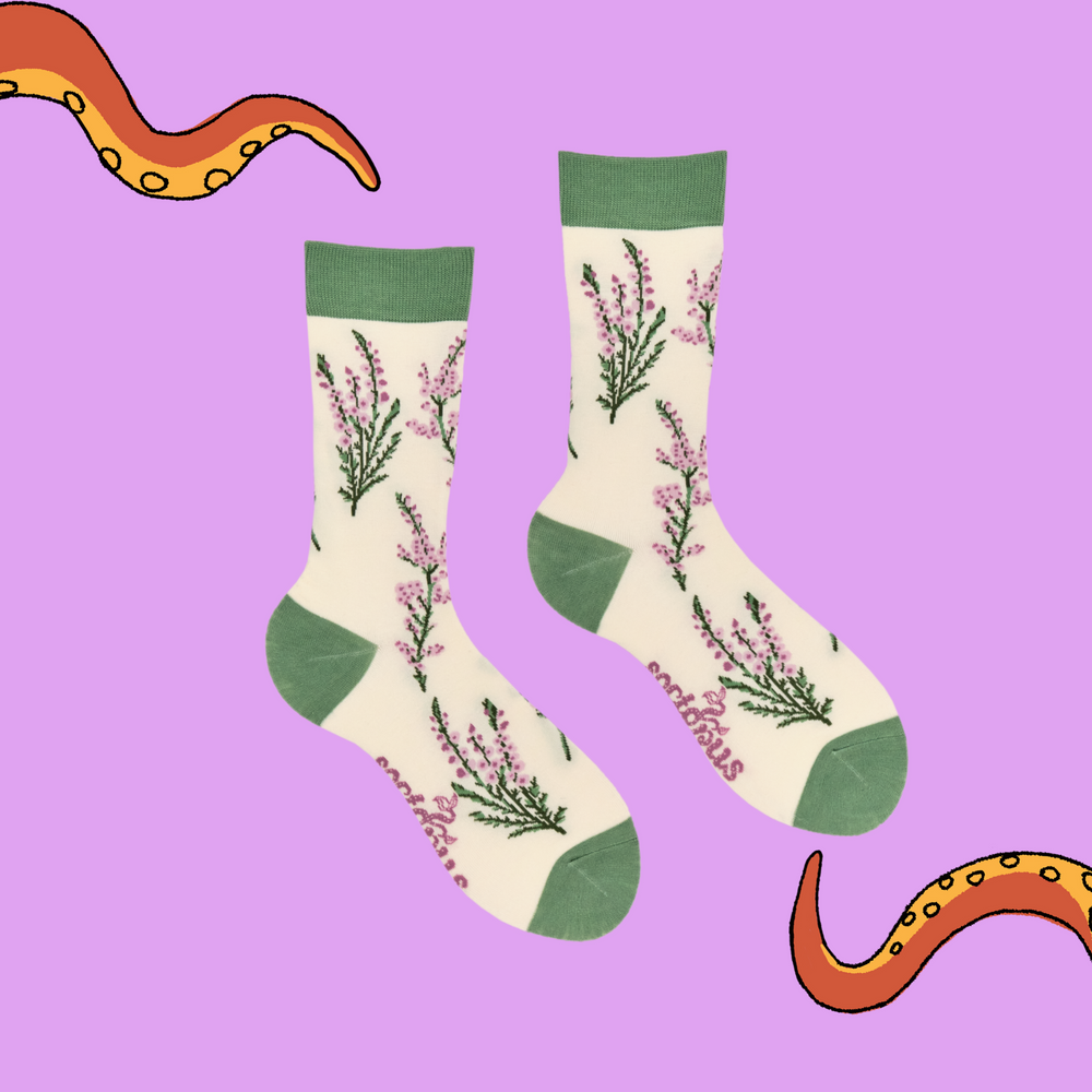 
                      
                        A pair of socks depicting wild heather. Cream legs, green cuff, heel and toe.
                      
                    