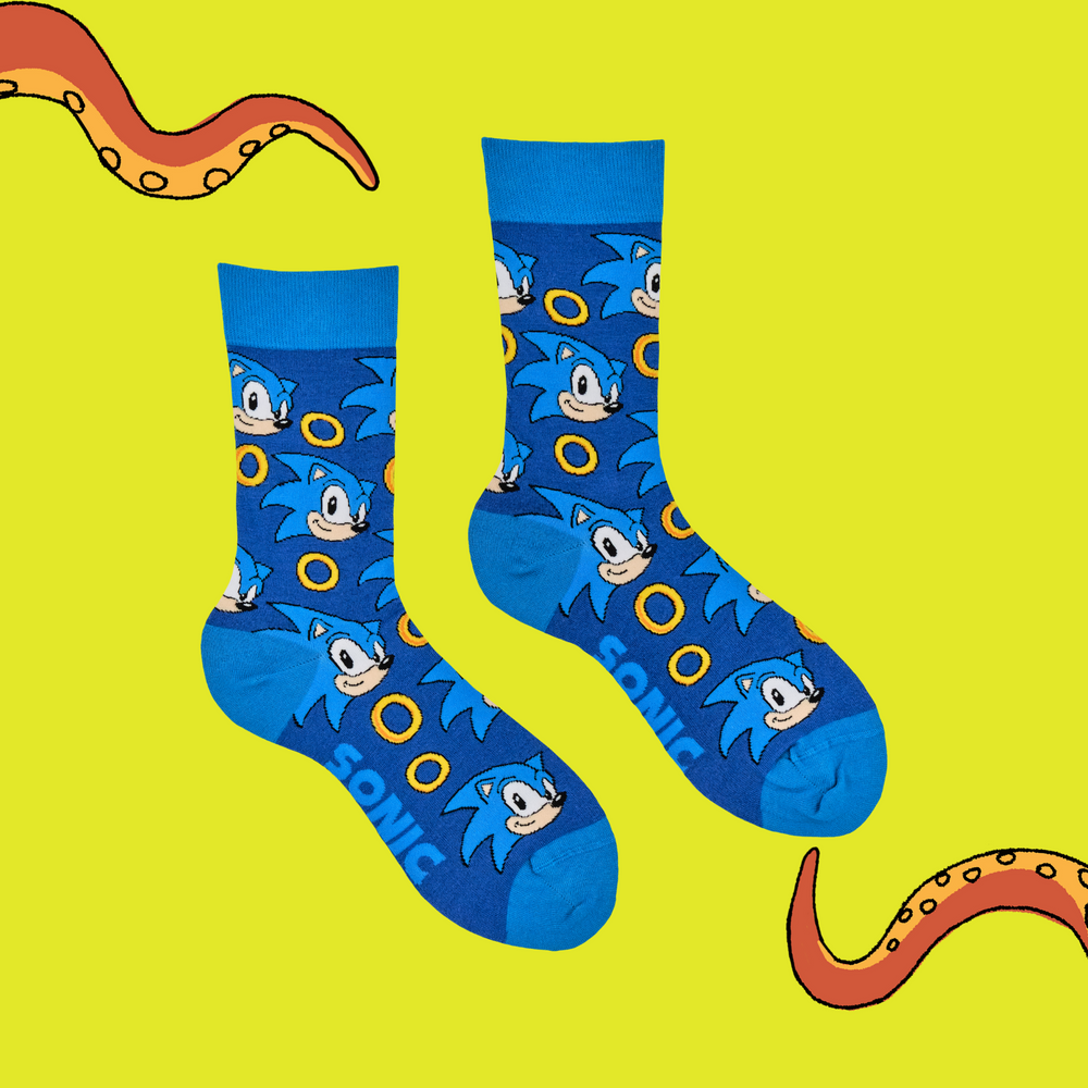 
                      
                        A pair of socks featuring Sonic with power rings. Dark blue legs, light blue heel, cuff and toe. 
                      
                    