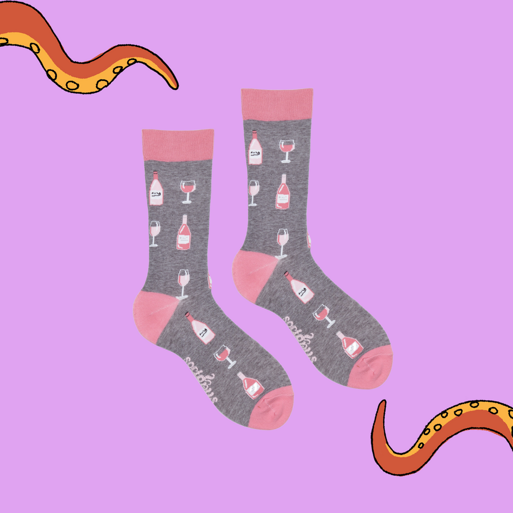 
                      
                        A pair of socks depicting Rose wine bottles and glasses. Grey legs, pink cuff, heel and toe.
                      
                    