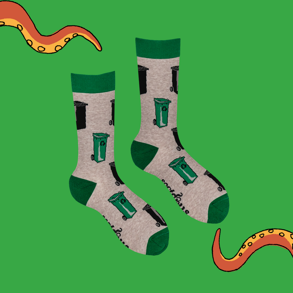 
                      
                        A pair of socks depicting wheelie bins. Brown legs, green toe, cuff and heel. 
                      
                    