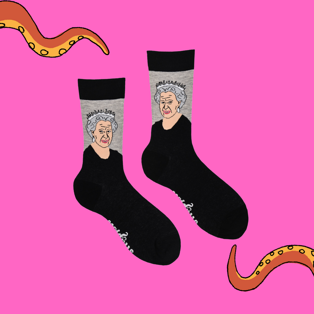 
                      
                        A pair of socks depicting HRH Queen Elizabeth II. Black legs, black cuff, heel and toe.
                      
                    