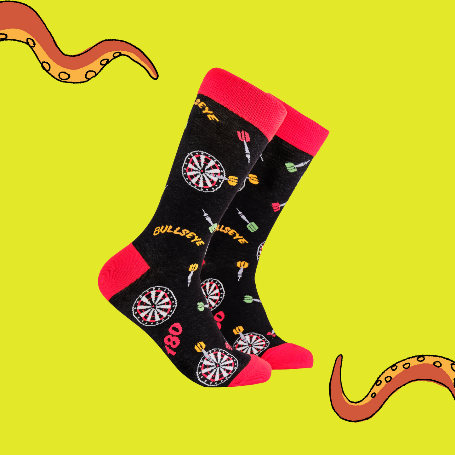 A pair of socks depicting darts and dartboards. Black legs, red cuff, heel and toe.