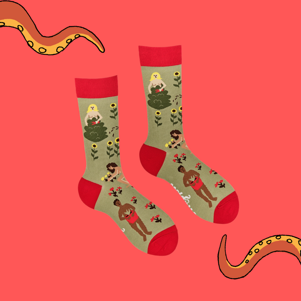 
                      
                        A pair of socks depicting naked gardeners. Green legs, red cuff, heel and toe.
                      
                    