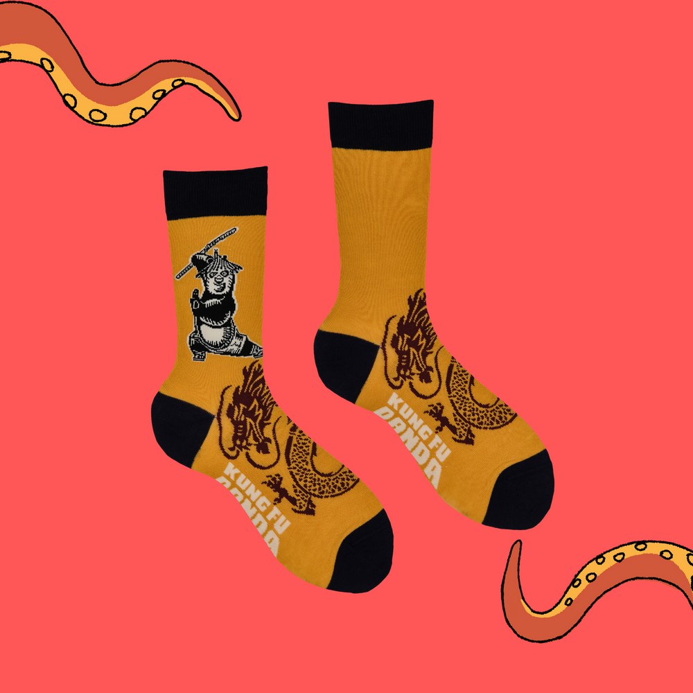 
                      
                        A pair of socks depicting Po striking a Kung Fu pose. Yellow legs, black heel, toe and cuff.
                      
                    