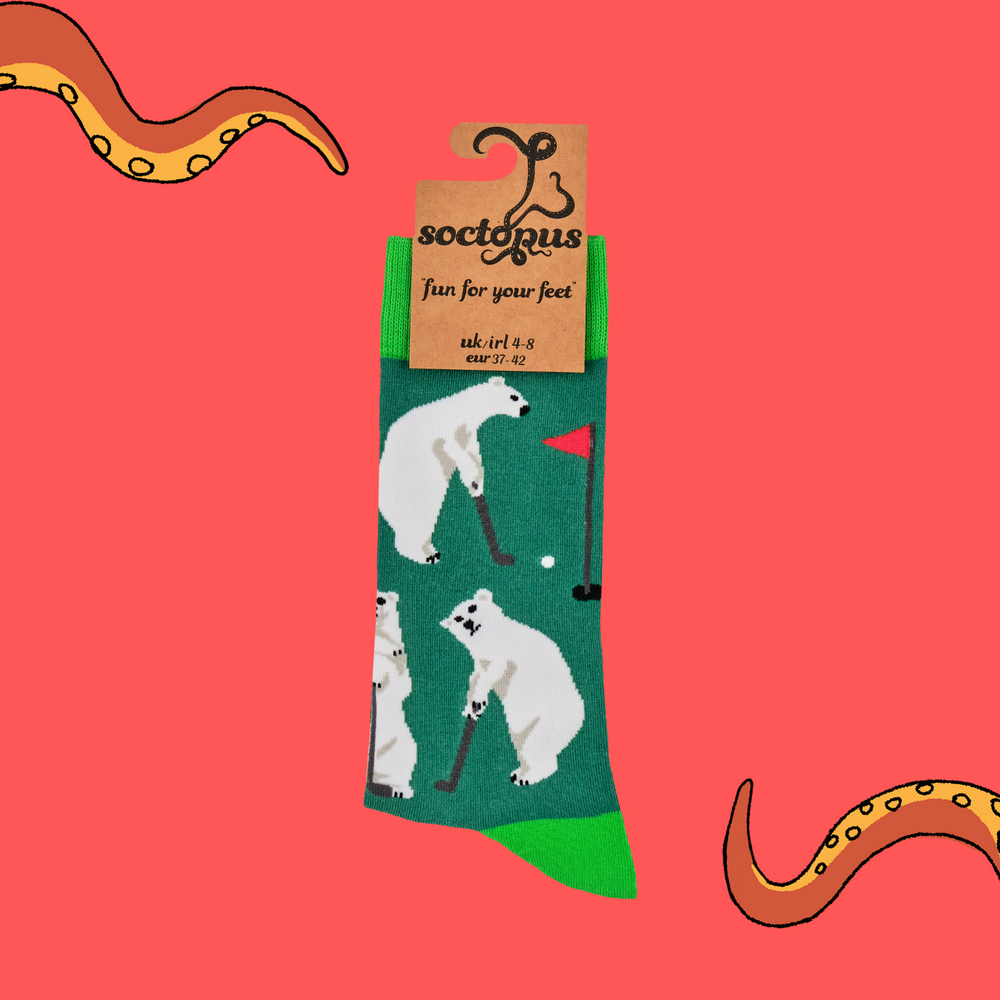 
                      
                        A pair of socks depicting a polar bear playing golf. Dark green legs, bright green heel, toe and cuff. 
                      
                    