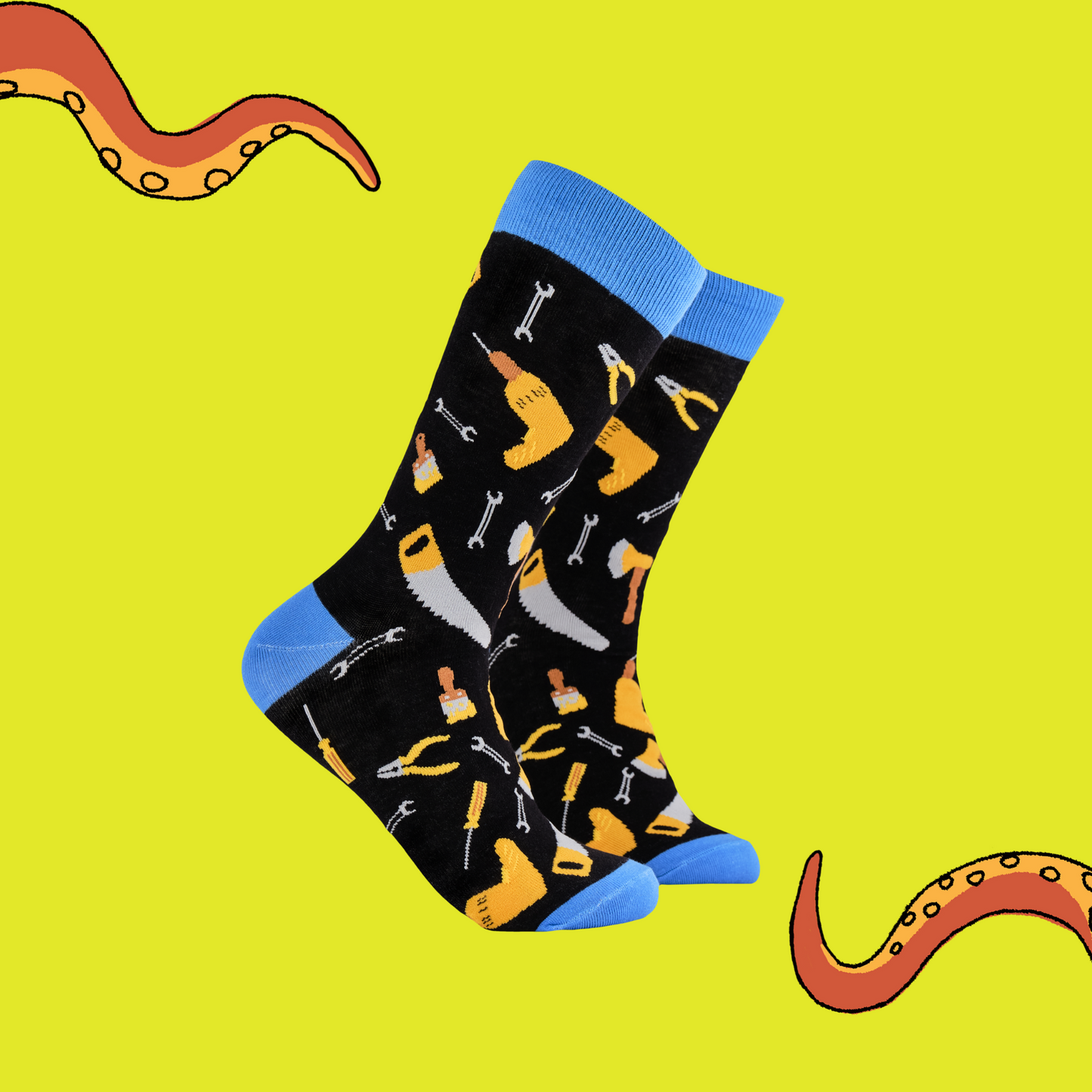 A pair of socks depicting DIY tools. Black legs, blue cuff, heel and toe.