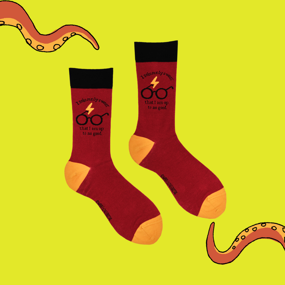 
                  
                    A pair of socks depicting Harry Potter glasses. Red legs, black cuff, yellow heel and toe.
                  
                