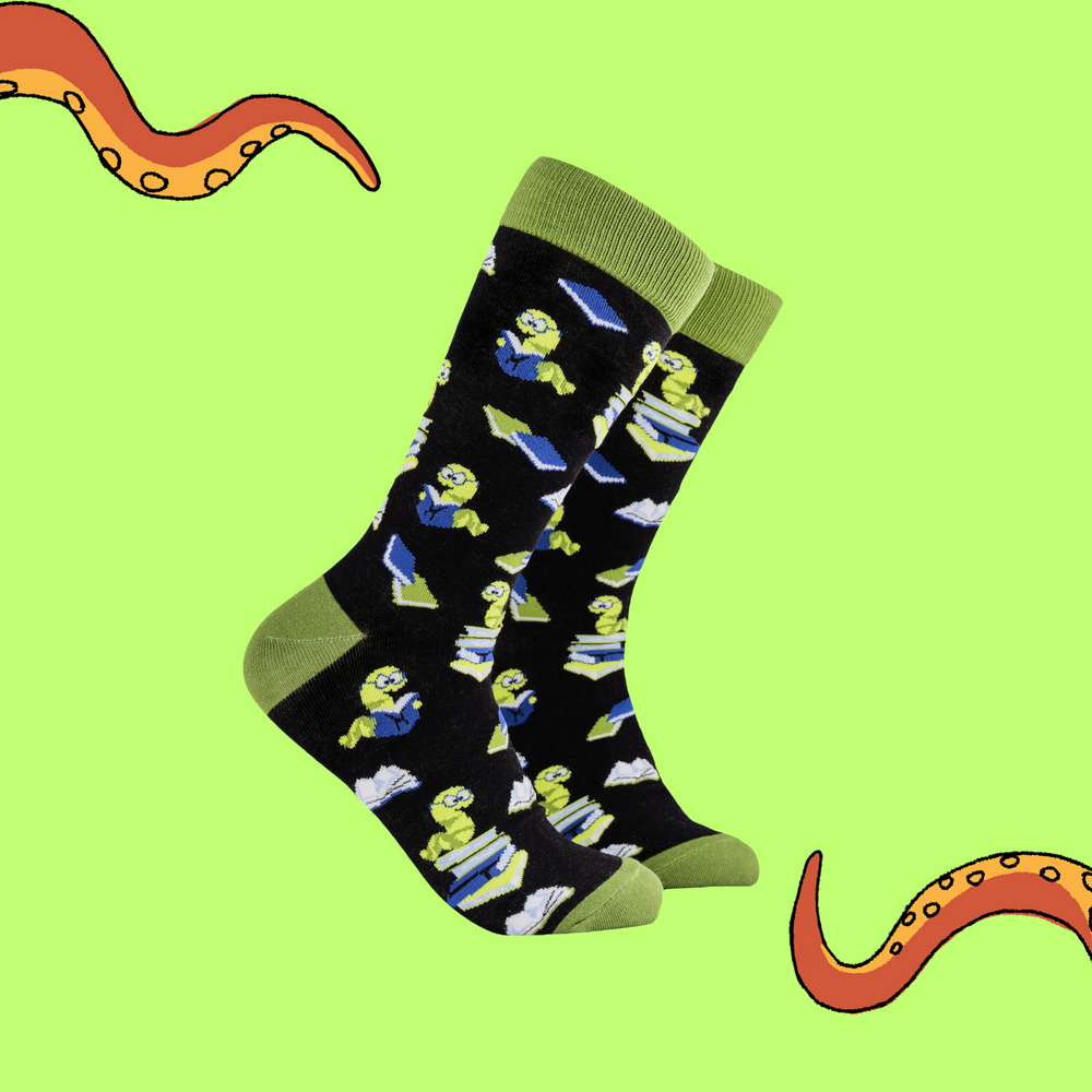 
                  
                    A pair of socks depicting worms reading books. Black legs, green cuff, heel and toe.
                  
                