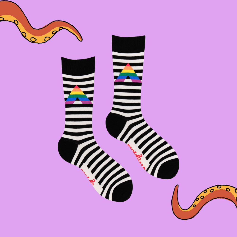 
                      
                        A pair of socks depicting a rainbow ally sign. Black and white striped legs, black cuff, heel and toe.
                      
                    