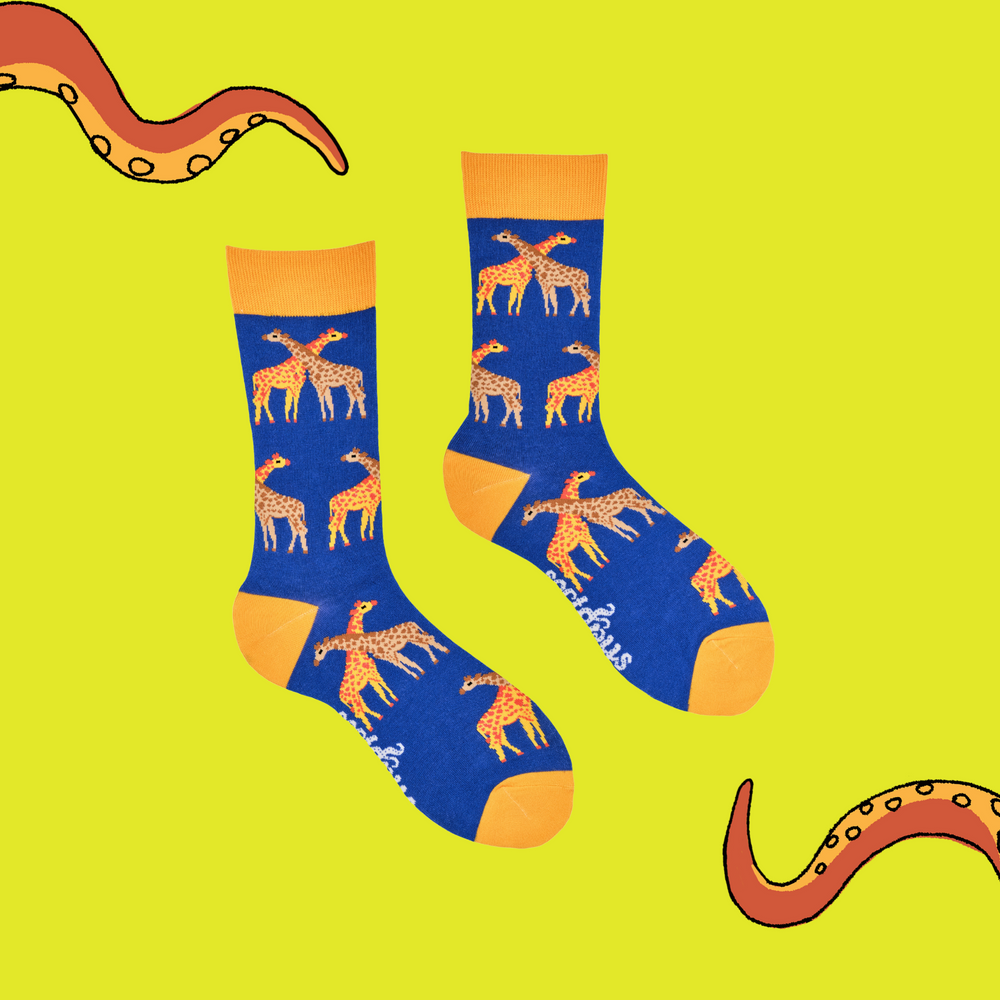 
                      
                        A pair of socks depicting giraffes. Royal blue legs, yellow cuff, heel and toe.
                      
                    