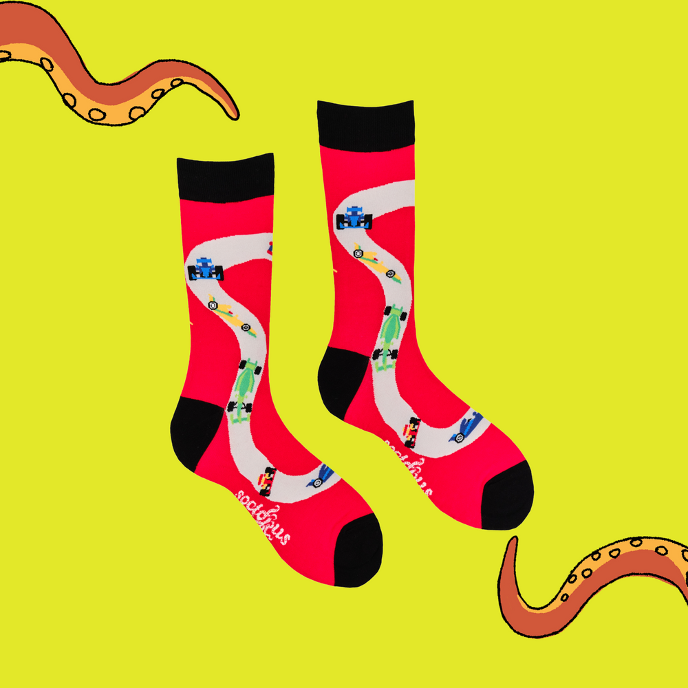 
                      
                        A pair of socks depicting F1 cars. Red legs, black cuff, heel and toe.
                      
                    