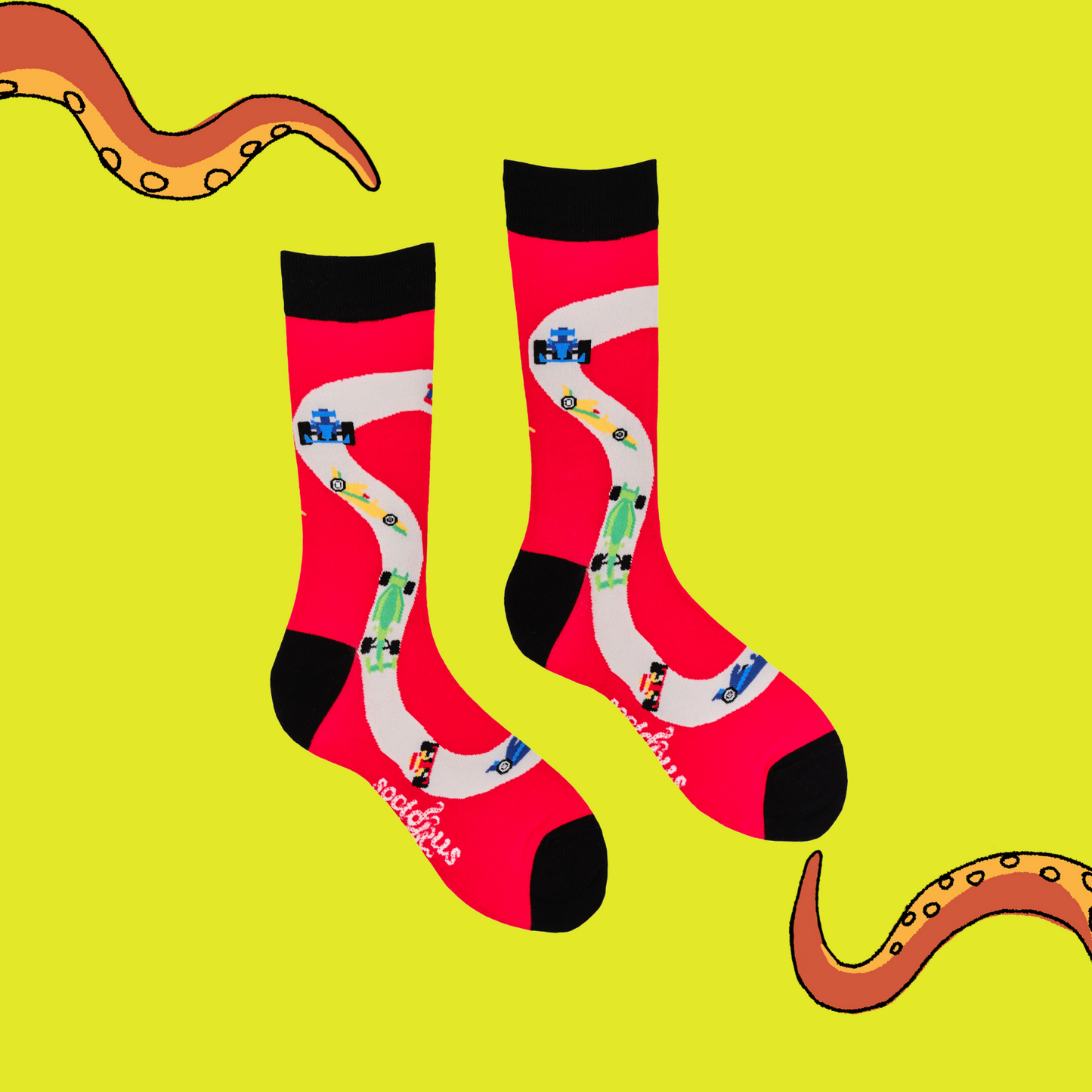 
                  
                    A pair of socks depicting F1 cars. Red legs, black cuff, heel and toe.
                  
                
