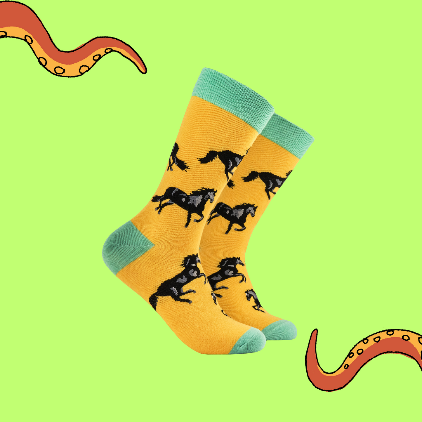 A pair of socks with a black stallion motif. Yellow legs, green heel toe and cuff. 