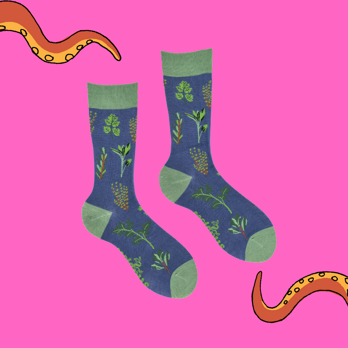 
                  
                    A pair of socks depicting tea cups and tea pots. Blue legs, green cuff, heel and toe.
                  
                