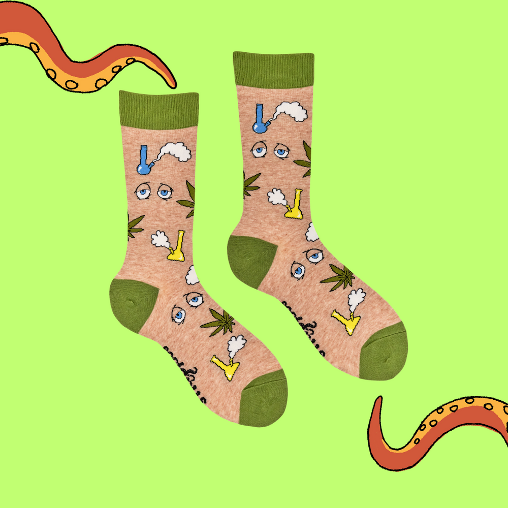 
                      
                        A pair of socks featuring bongs and weed. Beige legs, green heel, toe and cuff. 
                      
                    