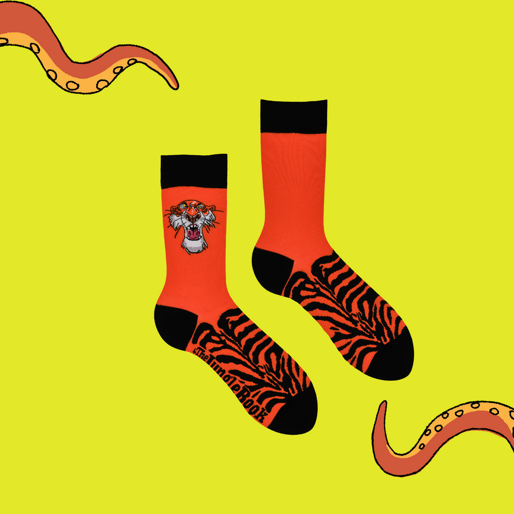 
                      
                        A pair of socks depicting the villain of Jungle Book. Shere Khan. Orange legs, black toes, cuffs and heel.
                      
                    