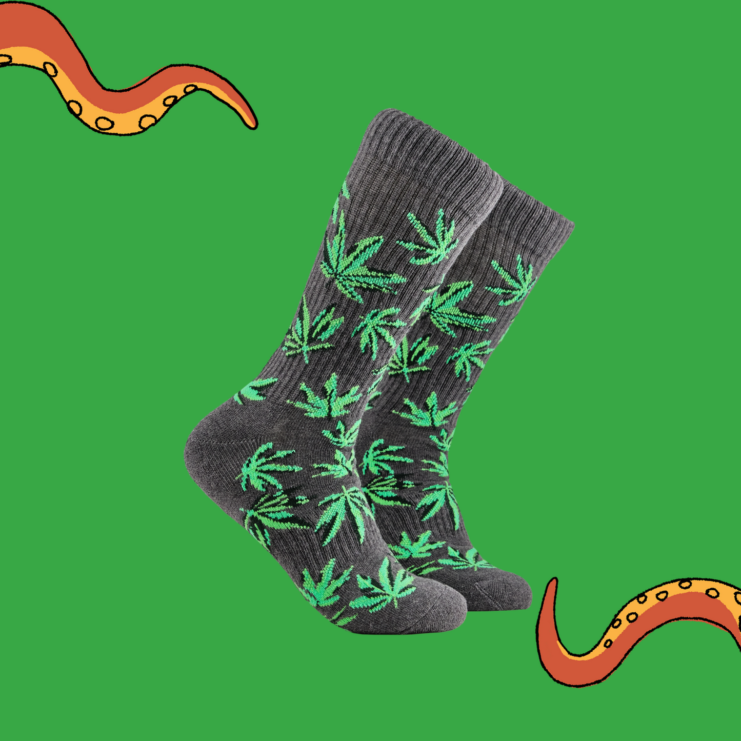 
                  
                    A pair of socks depicting cannabis leaves. Grey athletic legs, grey cuff, heel and toe.
                  
                