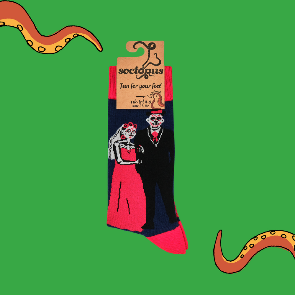 
                      
                        A pair of socks with a day of the dead motif. Dark blue legs, red heel, toe and cuff. 
                      
                    