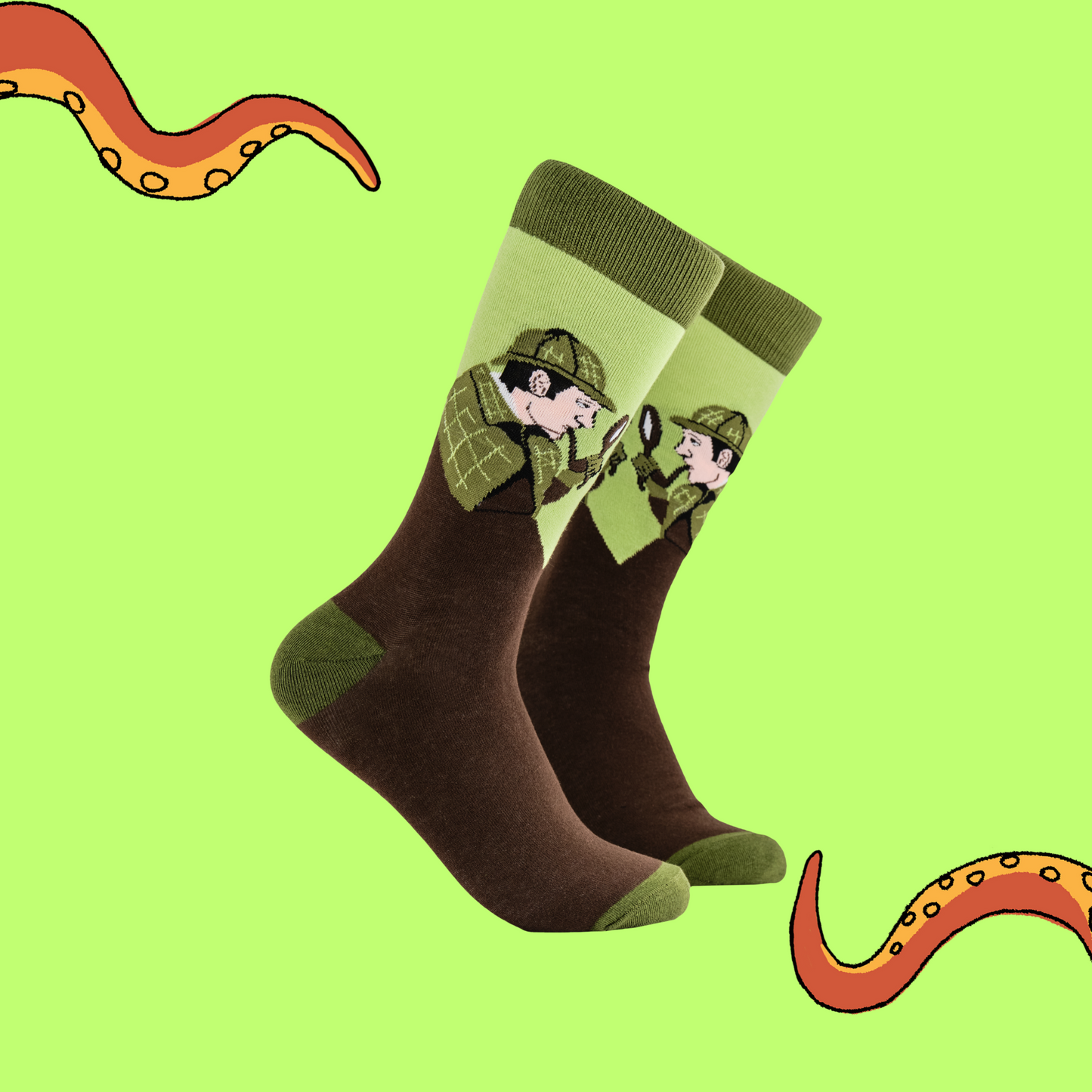 
                  
                     A pair of socks depicting Sherlock Holmes with hat and pipe. Brown legs, green cuff, heel and toe.
                  
                