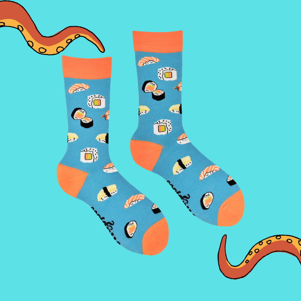 
                      
                        A pair of socks with a sushi motif. Bright blue legs, orange heel, toe and cuff. 
                      
                    