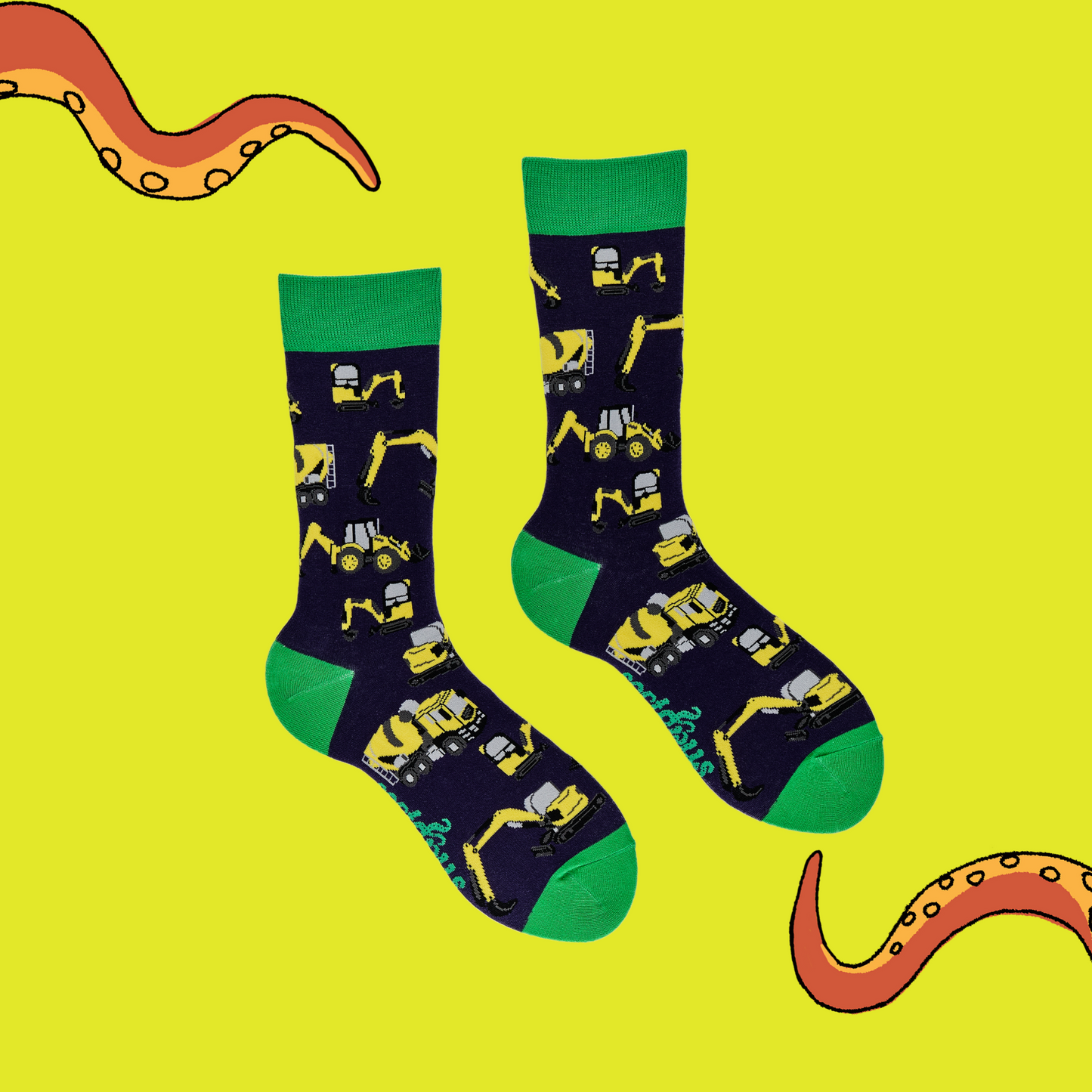 
                  
                    A pair of socks depicting yellow diggers and construction vehicles. Dark blue legs, green cuff, heel and toe.
                  
                