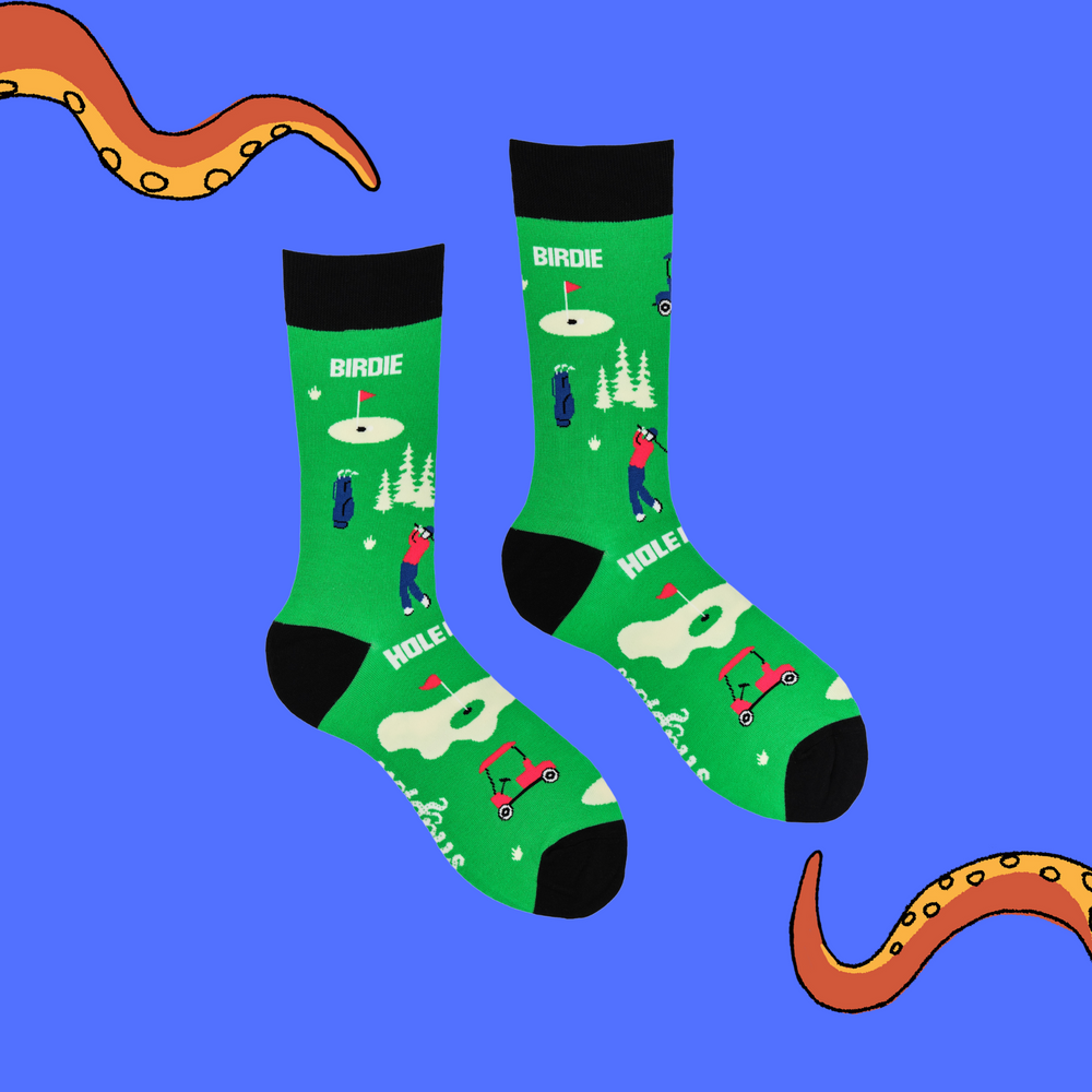 
                      
                        A pair of socks depicting golf. Green legs, black cuff, heel and toe.
                      
                    