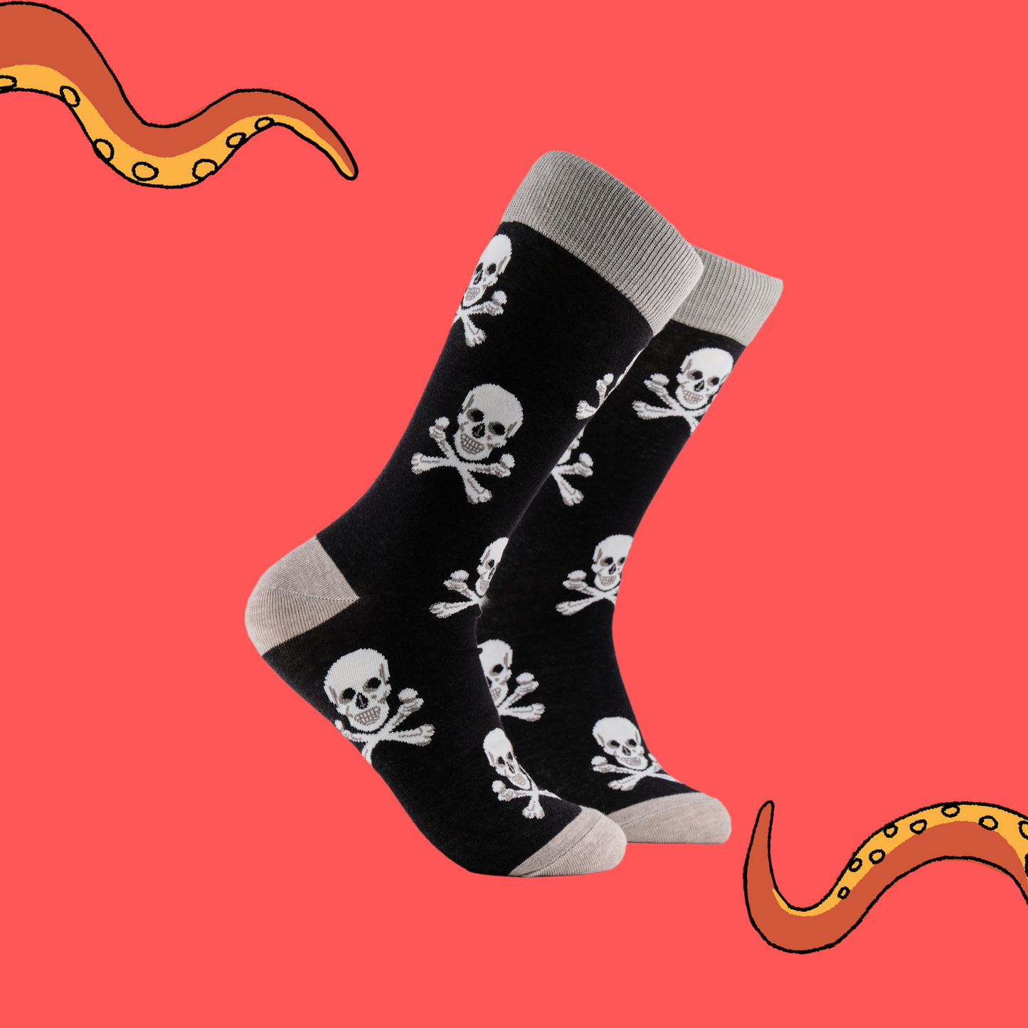 
                  
                    A pair of socks depicting the skull and crossbones. Black legs, grey cuff, heel and toe.
                  
                