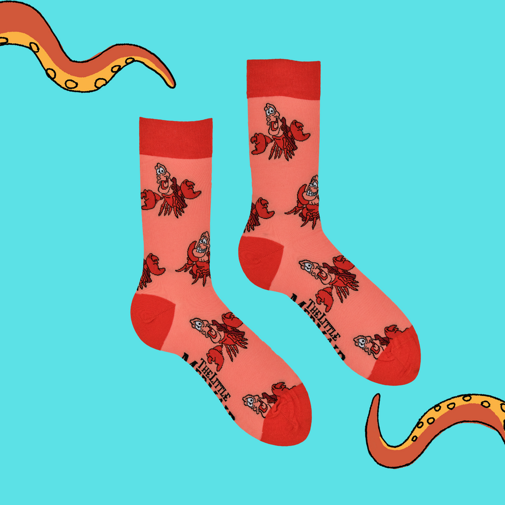 
                      
                        A pair of socks depicting Sebastian from The Little Mermaid. Coral legs, orange cuff, toe and heel.
                      
                    