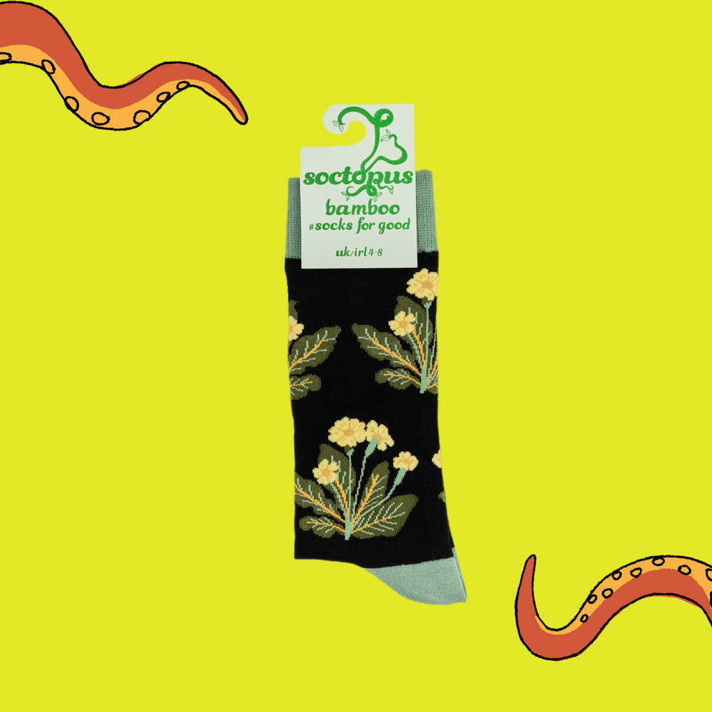 
                      
                        A pair of socks depicting primroses. Black legs, green cuff, heel and toe. In Soctopus Packaging.
                      
                    