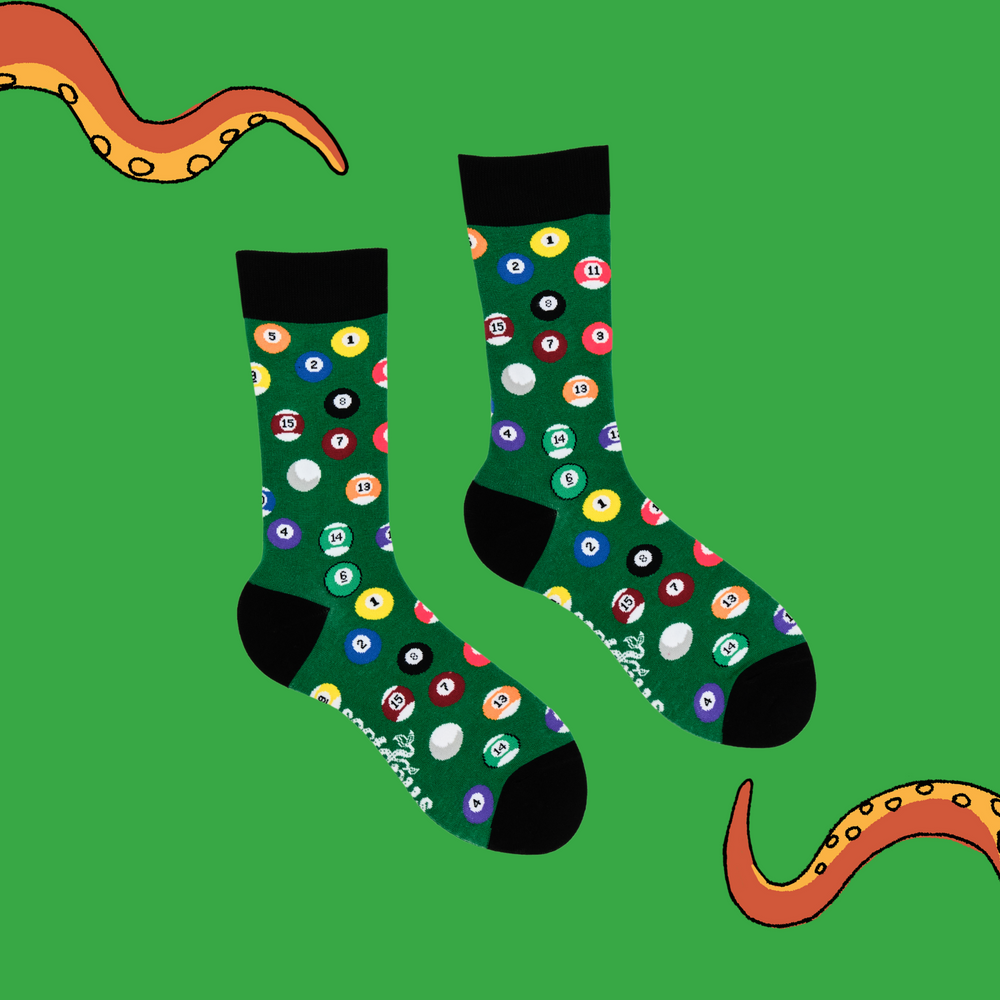 
                  
                    A pair of socks depicting pool balls. Green legs, black cuff, heel and toe.
                  
                