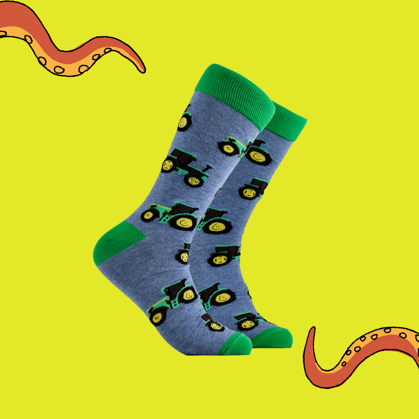 
                  
                    A pair of socks depicting green tractors. Blue legs, green cuff, heel and toe.
                  
                