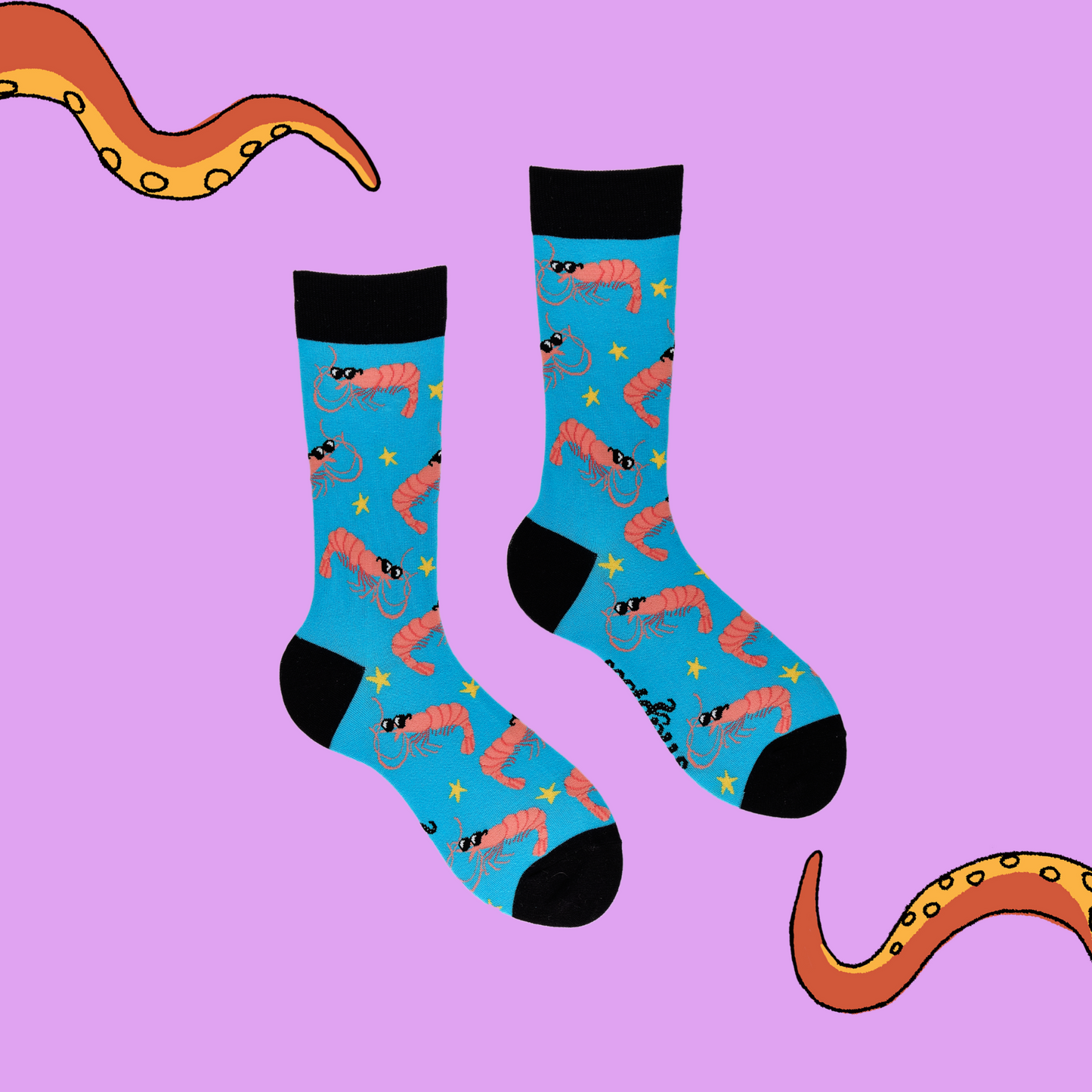 
                  
                    A pair of socks depicting cool prawns in sunglasses. Bright blue legs, black cuff, heel and toe.
                  
                