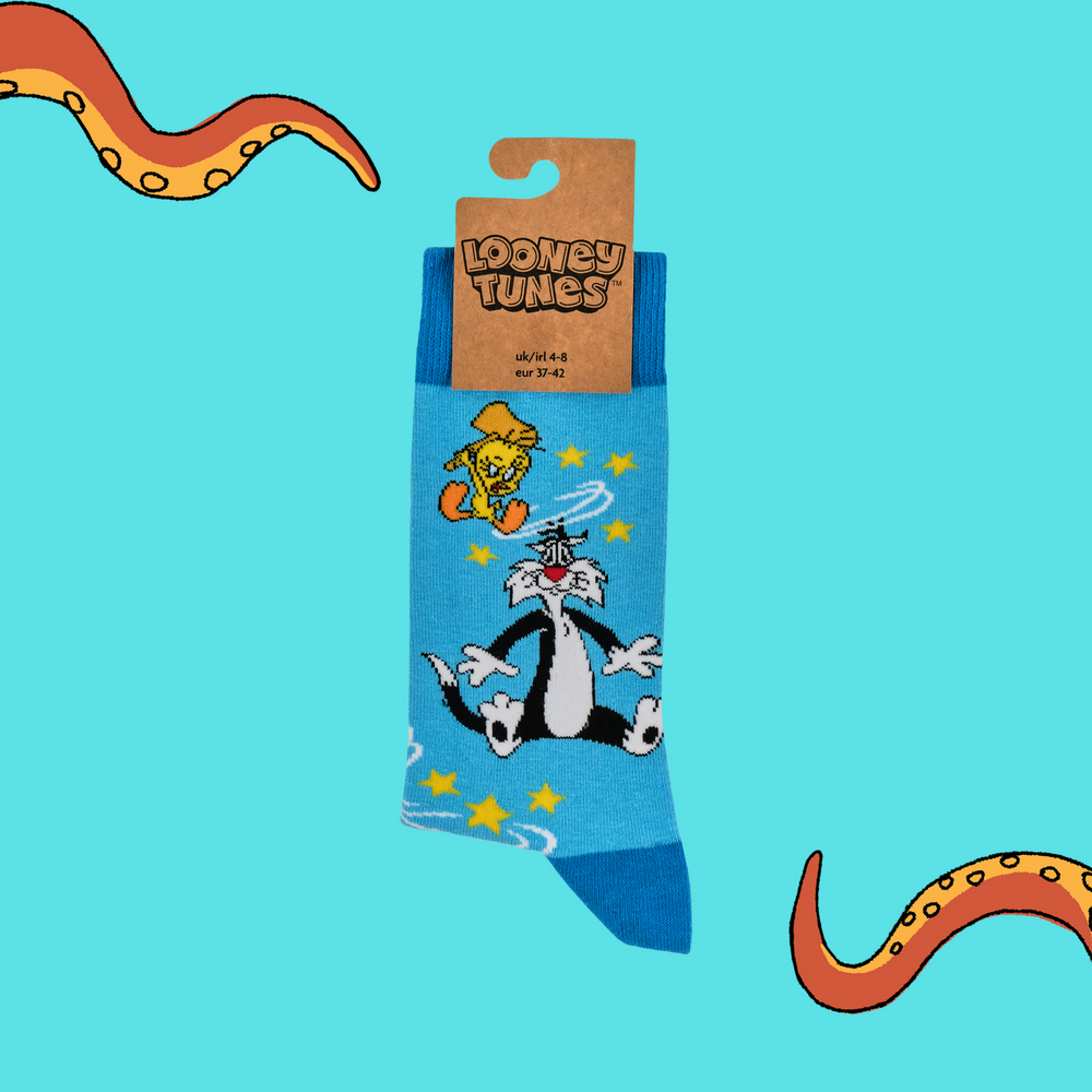 
                      
                        A pair of socks depicting Sylvester & Tweety. Blue legs, dark blue heel, cuff and toe. 
                      
                    