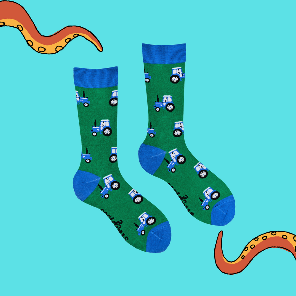 
                      
                        A pair of socks depicting blue tractors. Green legs, blue cuff, heel and toe.
                      
                    